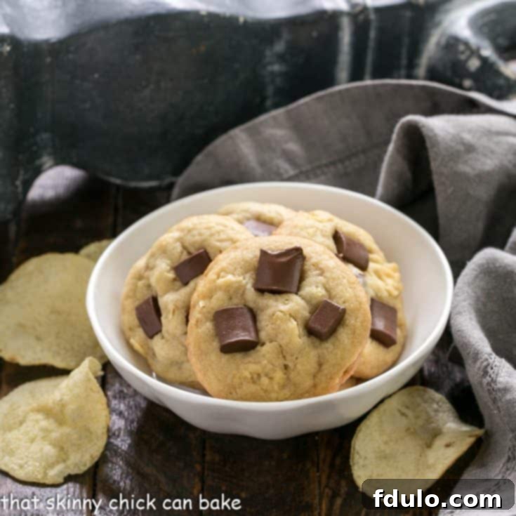 The Salty Sweet Chocolate Crunch Cookie 5 Delicious Chocolate Chunk Potato Chip Cookies in a small white bowl, ready to be enjoyed.