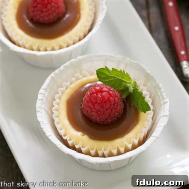 Caramel Drizzled Mini Cheesecakes 2 Close overhead view of mini cheesecakes topped with caramel and mint