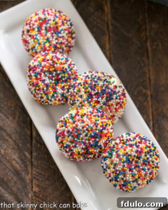 Sprinkle cookies on a white rectangular tray